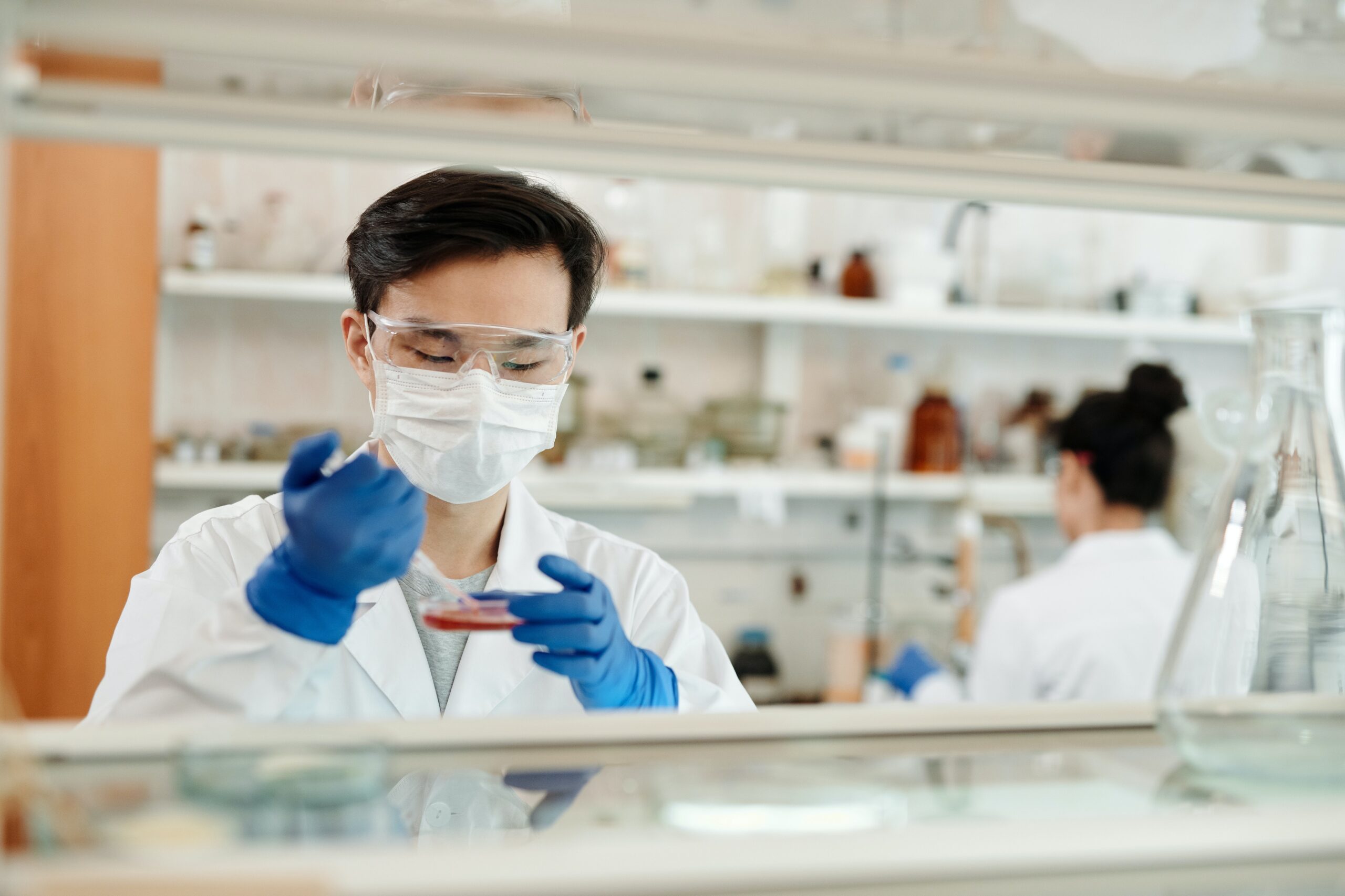 Researchers in a lab conducting work