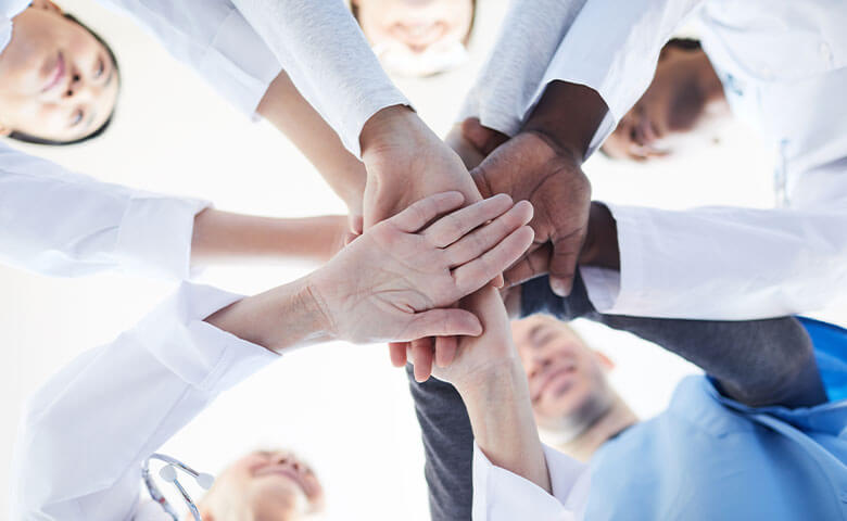 Group of medical professionals huddling